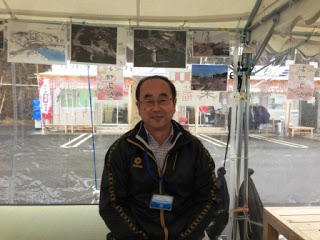 店主のマルタケさんの写真