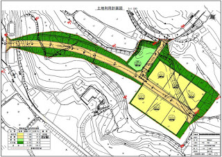 中央の道路を挟んで左右に宅地が配置され、緑地帯も含めて区画整理された様子が色分けされて示された土地利用計画図の画像