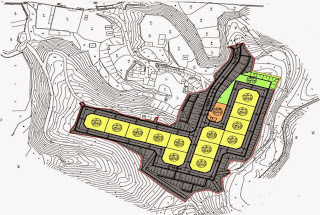 斜面に沿った土地に区画が整然と配置され、中央に道路や公園と思われる空間があり、住宅用地と公共施設の計画が示された高台移転地区の土地利用計画図の画像