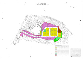 色分けされた区画が並ぶ土地利用計画図で、住宅地や商業地、公共施設などの配置が視覚的に示されている様子が写っている土地利用計画図の写真