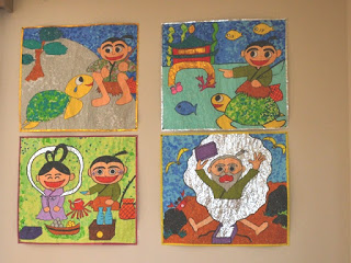 壁に展示された4枚の浦島太郎のちぎり絵パネルの写真