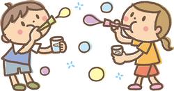 シャボン玉を吹いて遊んでいる男の子と女の子が描かれたイラスト